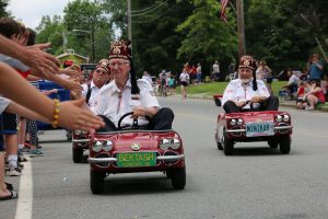 participate in events: small town parade
